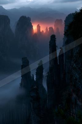 A dramatic sky scene of sunrise, valley, mountains.