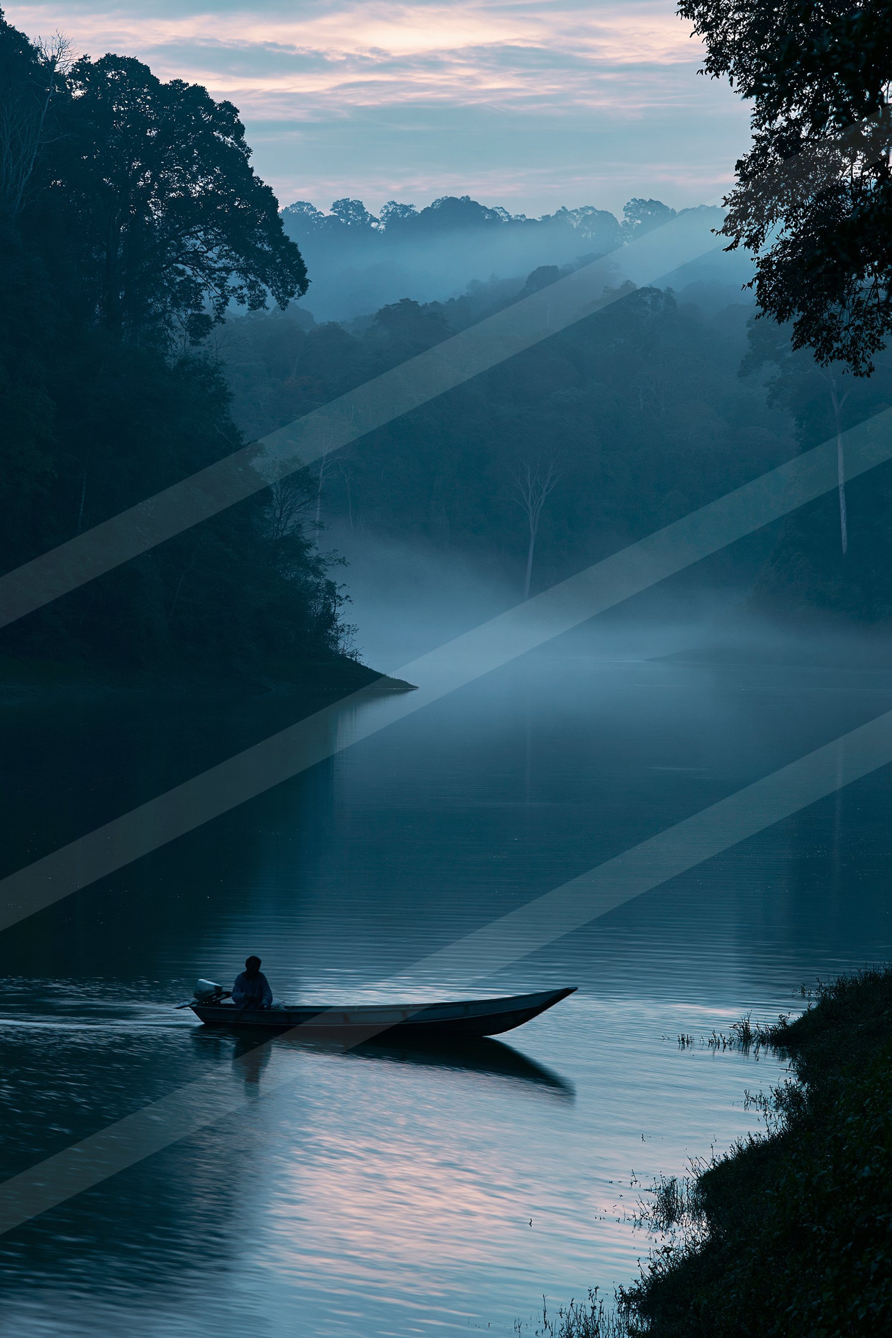 A blue hour water scene of a lake, fog.