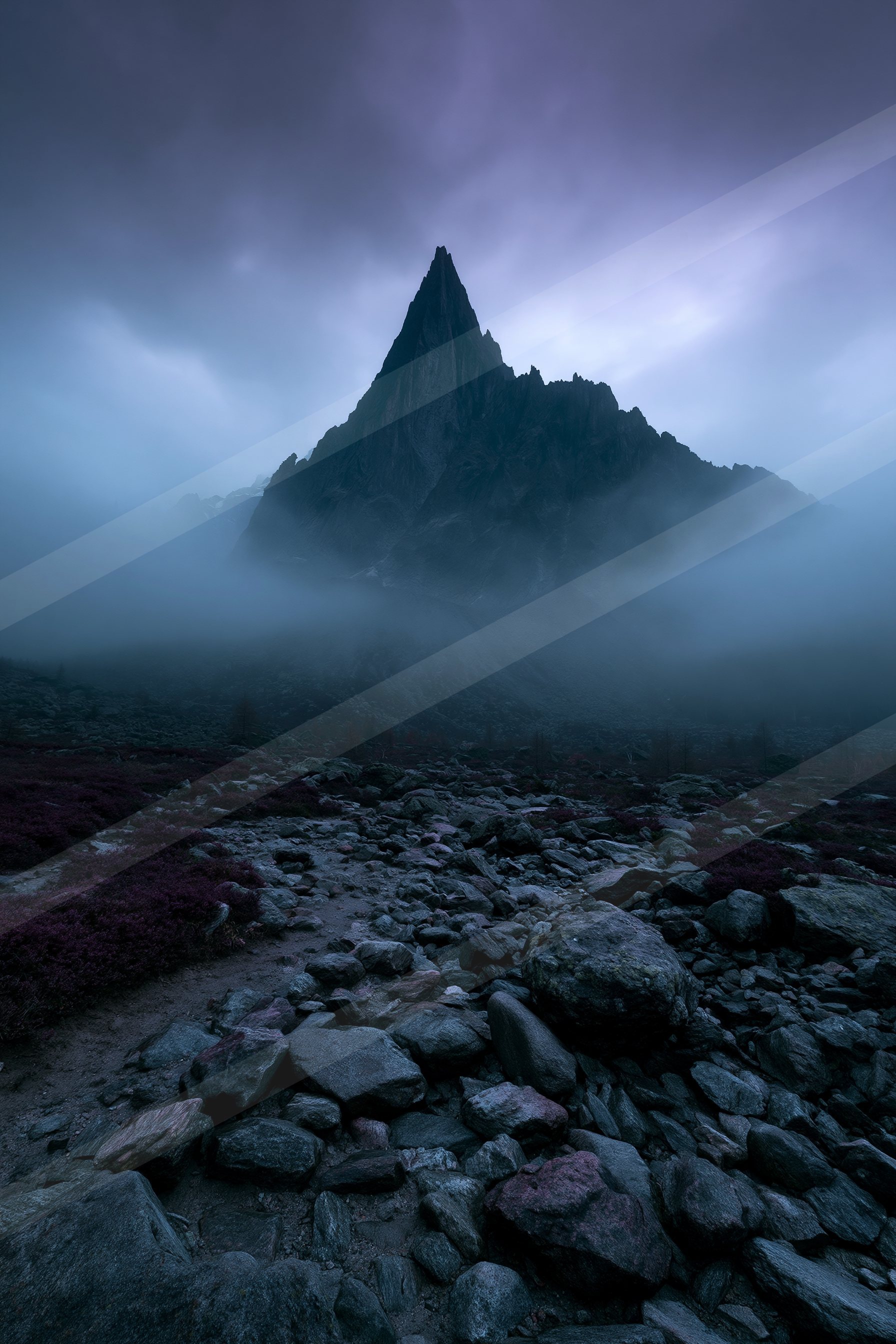 A mysterious landscape of a mountains, fog.
