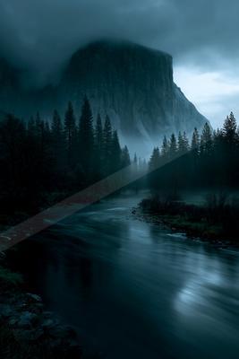 A dramatic long exposure water scene of river, valley, mountains.