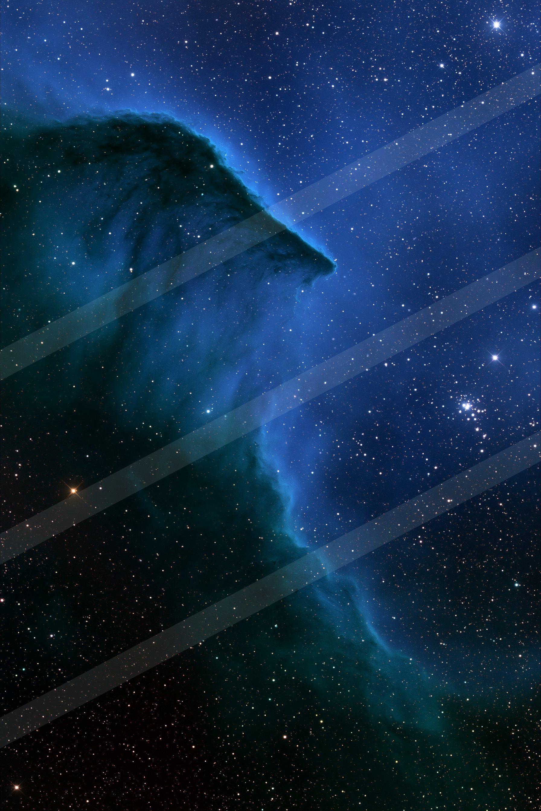 A stunning view of a nebula with swirling cosmic clouds against a star-filled night sky.