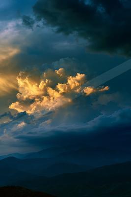 A brown-toned moody photograph of volcano, alp, lakeside.