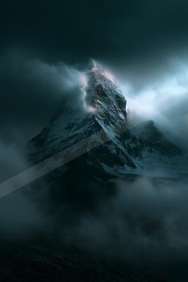 A mysterious high contrast landscape of a mountains, fog.
