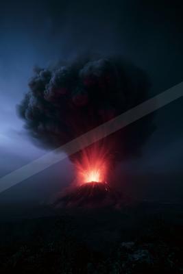 A powerful volcanic eruption at night, with bright red lava exploding from the crater and a massive plume of dark ash rising into the sky.