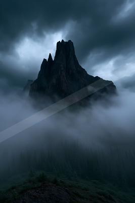 A mysterious long exposure landscape of a mountains, fog.