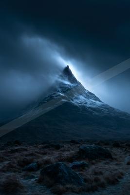 A night landscape of mountains, storm, fog.
