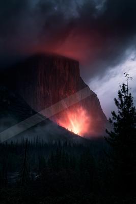 A moody landscape of mountains, valley.
