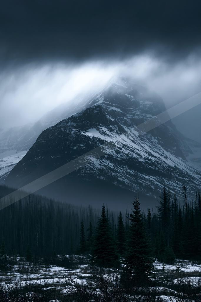 A moody landscape of mountains.