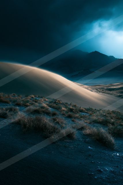 A night high contrast landscape of a sand dune, dust.