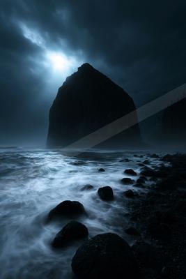 A night water scene of beach, ocean, storm.
