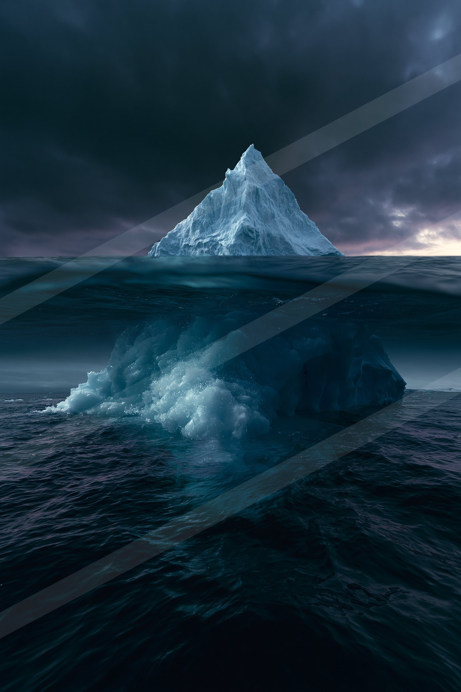 A towering iceberg floats on dark waters under a moody sky.