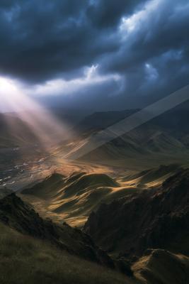 A dramatic sky scene of storm, valley, clouds.