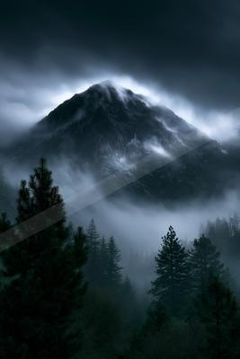 A night landscape of mountains, storm, forest.
