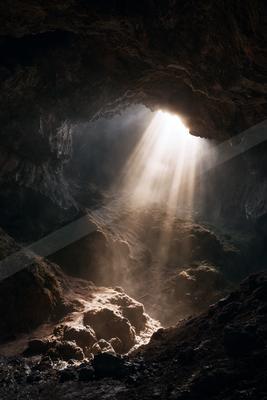 A mysterious landscape of a cave.