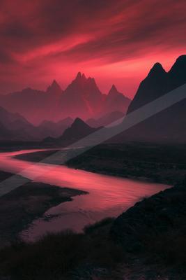 A striking landscape featuring jagged mountain peaks under a vivid red sky with a reflective river winding through the foreground.
