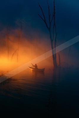 A black-toned moody photograph of paddle, canoe, lakeside.