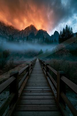 A moody architecture photo of bridge, mountains.