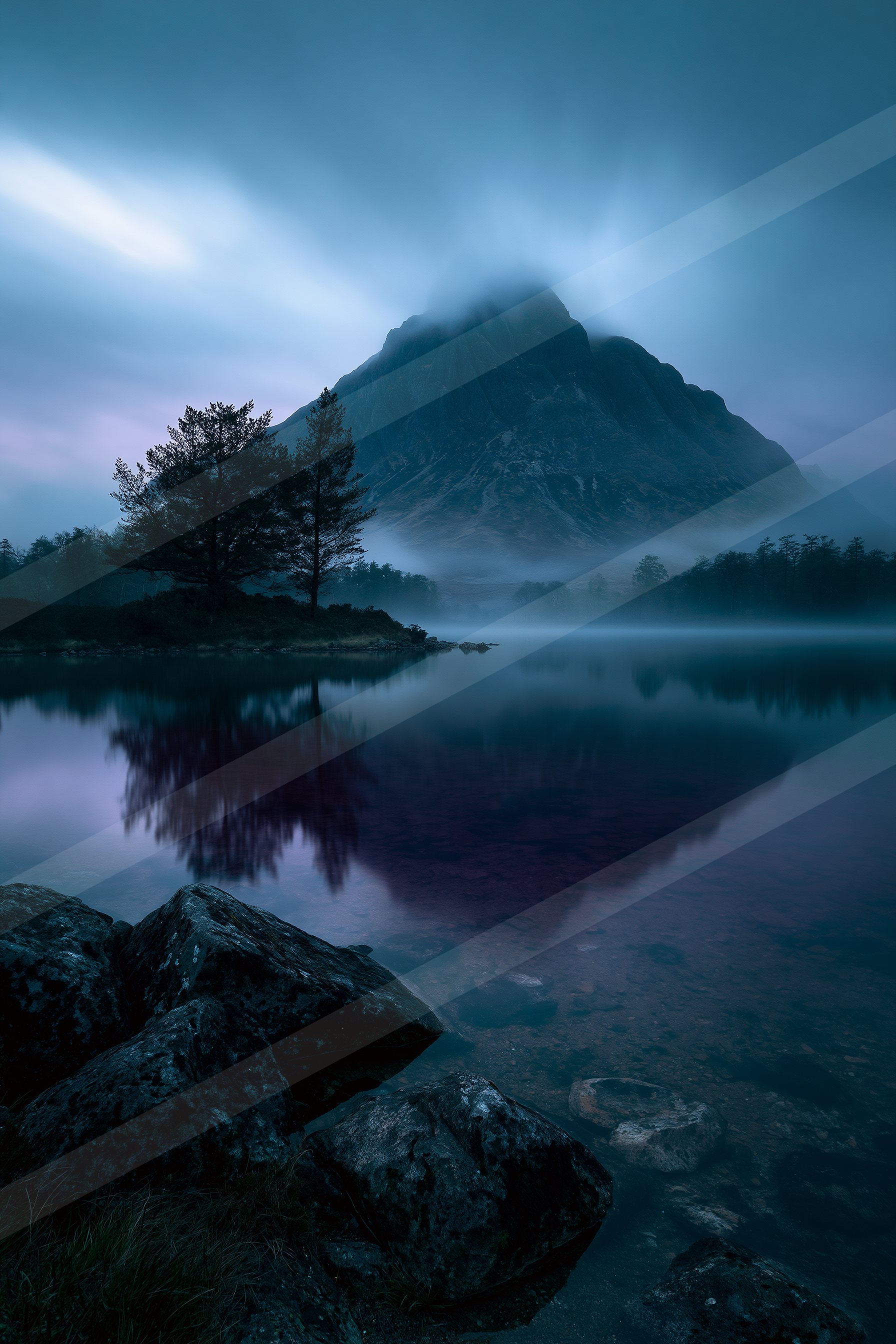 A blue hour panorama landscape of a mountains, reflection.
