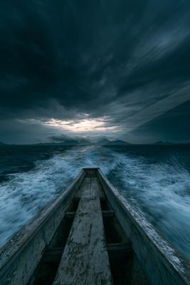 A blue hour long exposure water scene of ocean, storm.