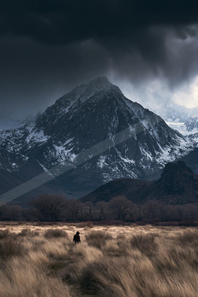 A moody high contrast landscape of a mountains.