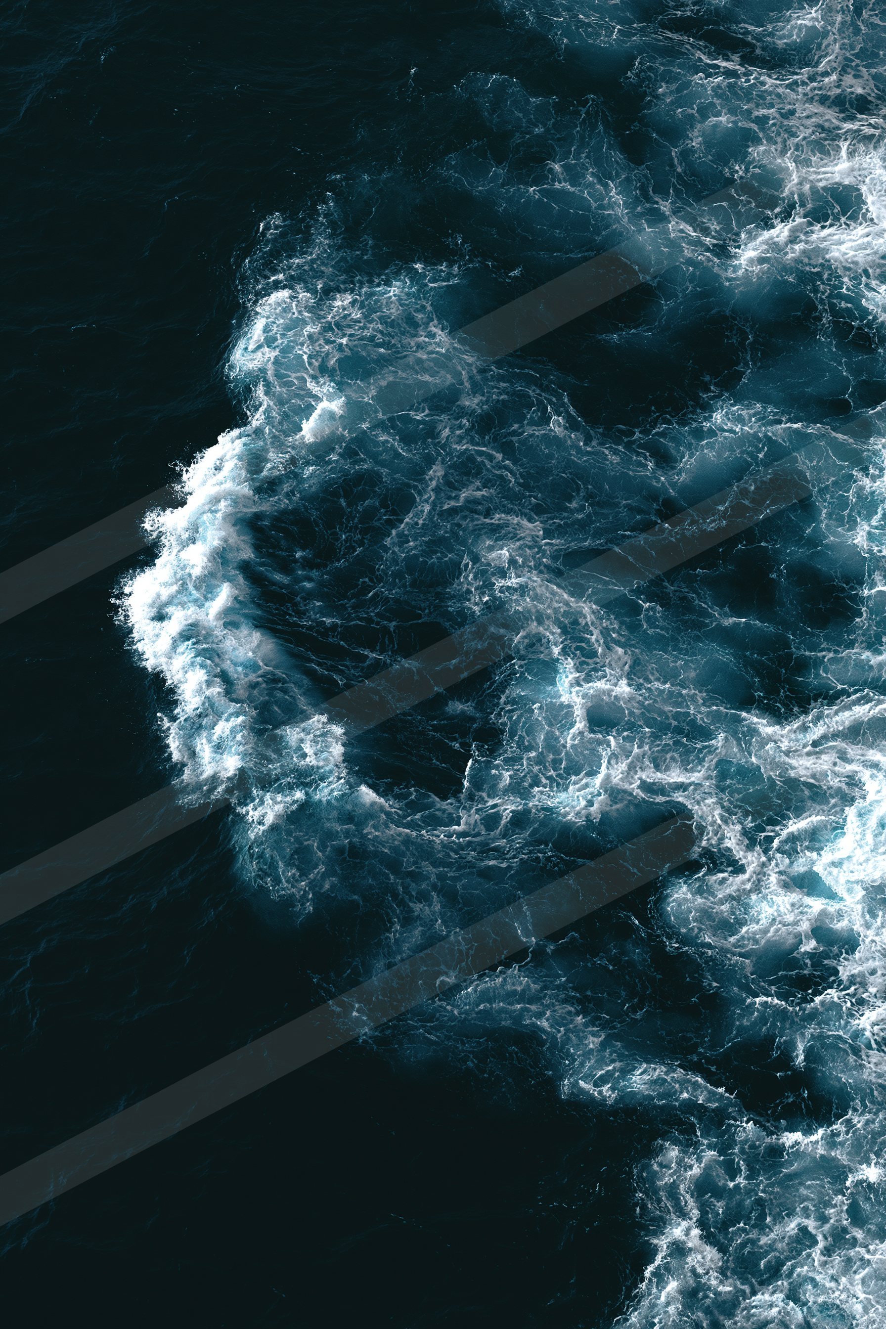 An ethereal high contrast water scene of an ocean waves, ripples.
