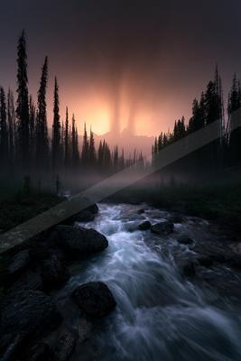 A dramatic long exposure water scene of river, storm, waterfall.