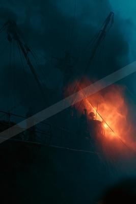 A black-toned moody photograph of wreck, pirate, drilling platform.