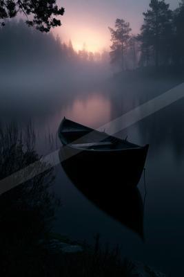 A serene water scene of lake, sunrise, fog.