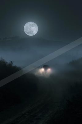 A vehicle with bright headlights drives along a dirt road through thick fog at night, under a large glowing full moon in a dark sky.