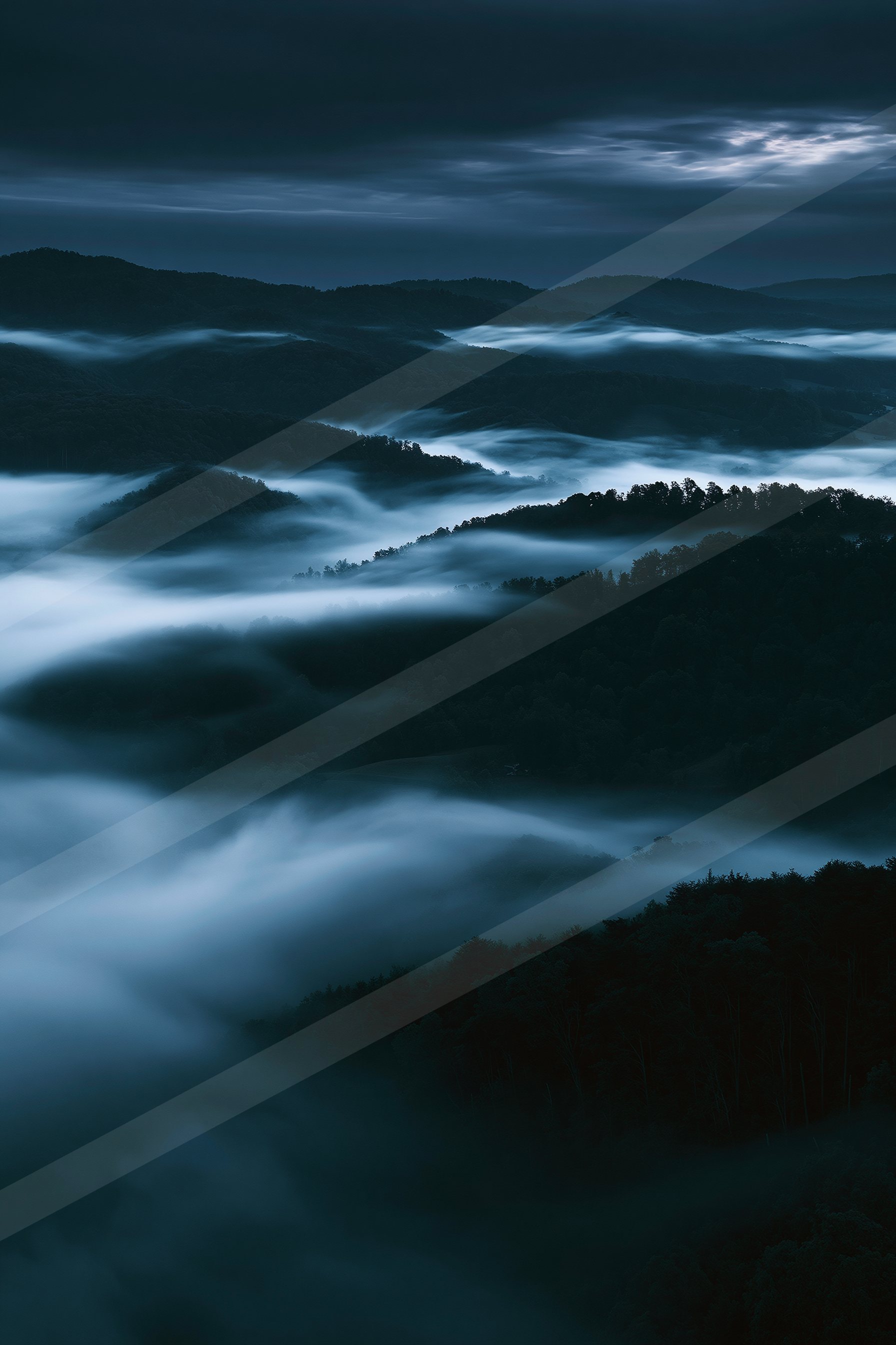 A night long exposure landscape of a rolling hills, fog.
