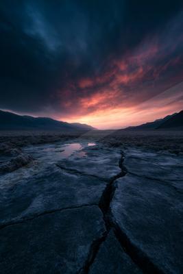 A blue hour sky scene of sunrise, lake, sunset.