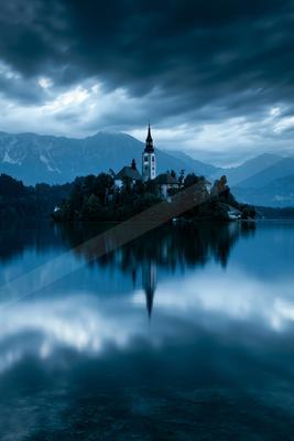 A blue hour long exposure water scene of lake, reflection.