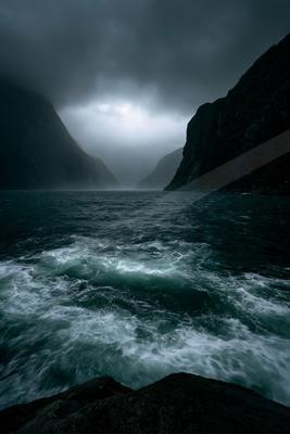 A dramatic water scene of ocean, storm, fog.