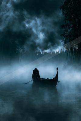 A green-toned moody photograph of canoe, paddle, gondola.