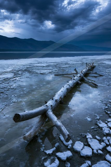 A dramatic long exposure water scene of a lake, ice.