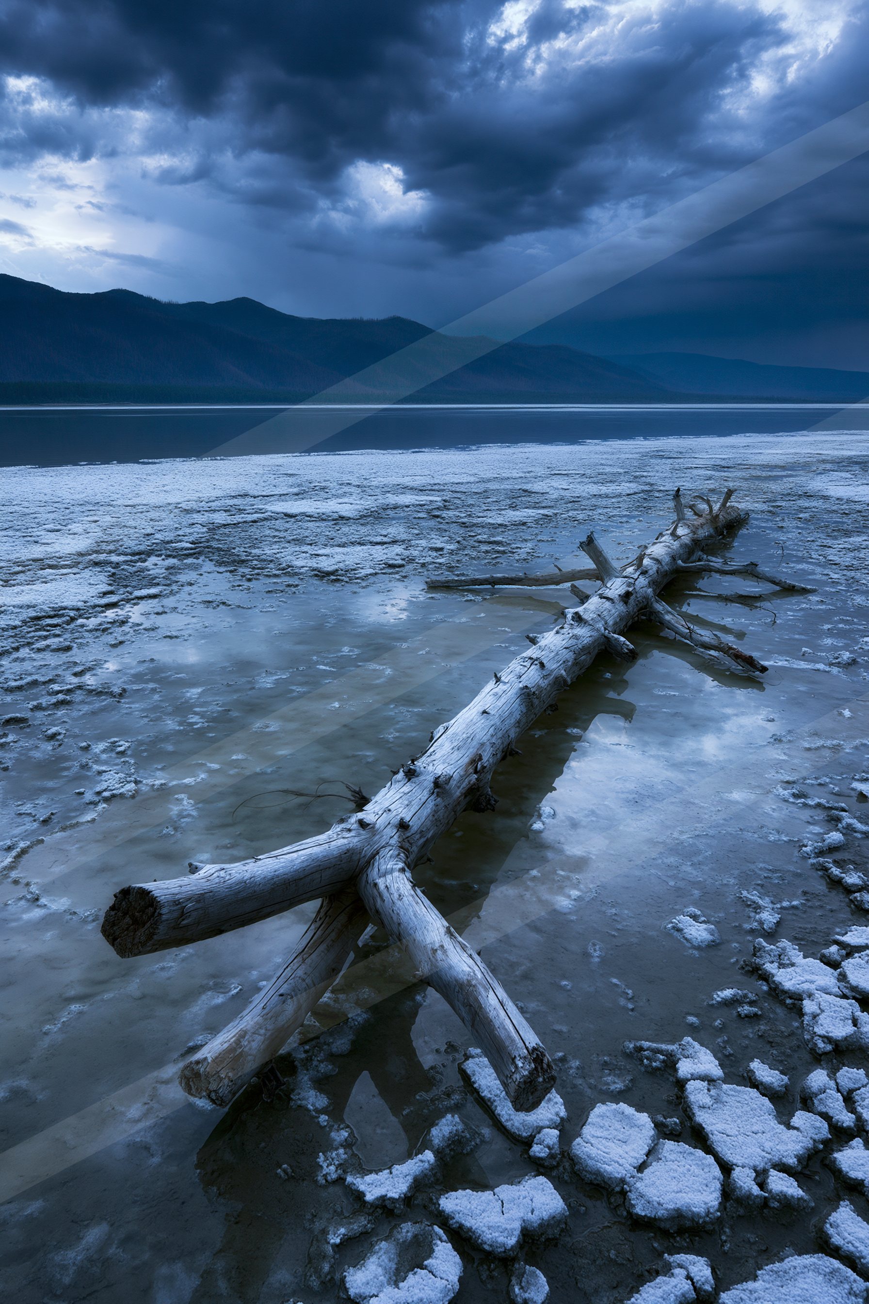 A dramatic long exposure water scene of a lake, ice.