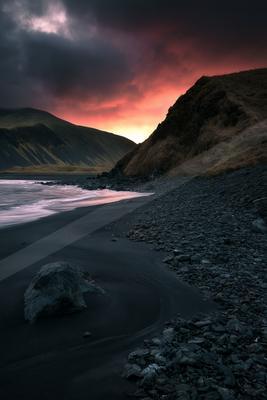 A moody water scene of beach, desert, valley.