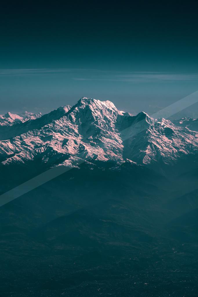 A night landscape of mountains, snow.