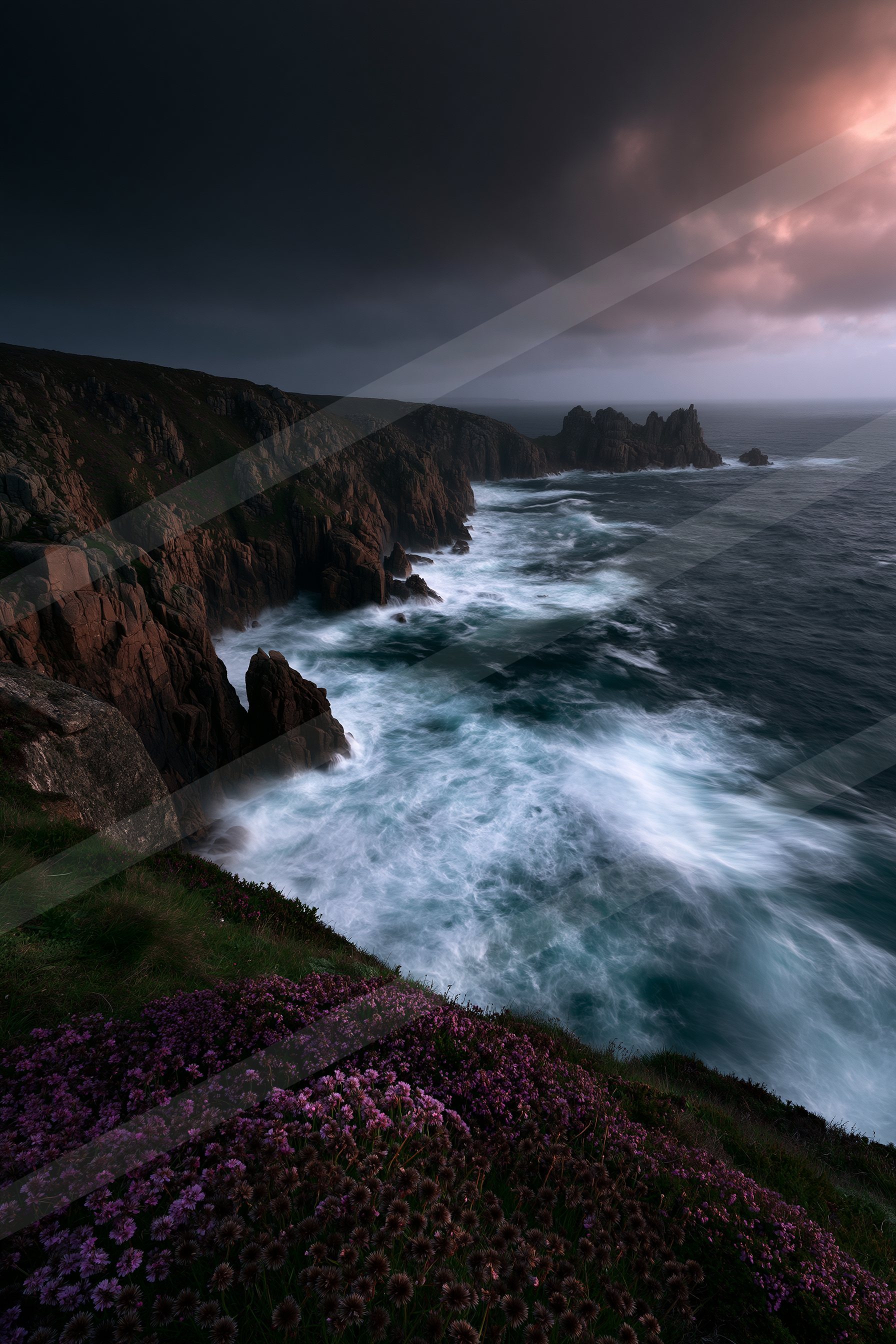 A moody long exposure water scene of a coastline, fog.
