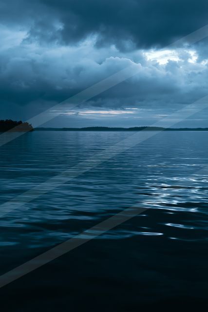 A blue hour high contrast water scene of an ocean, reflection.