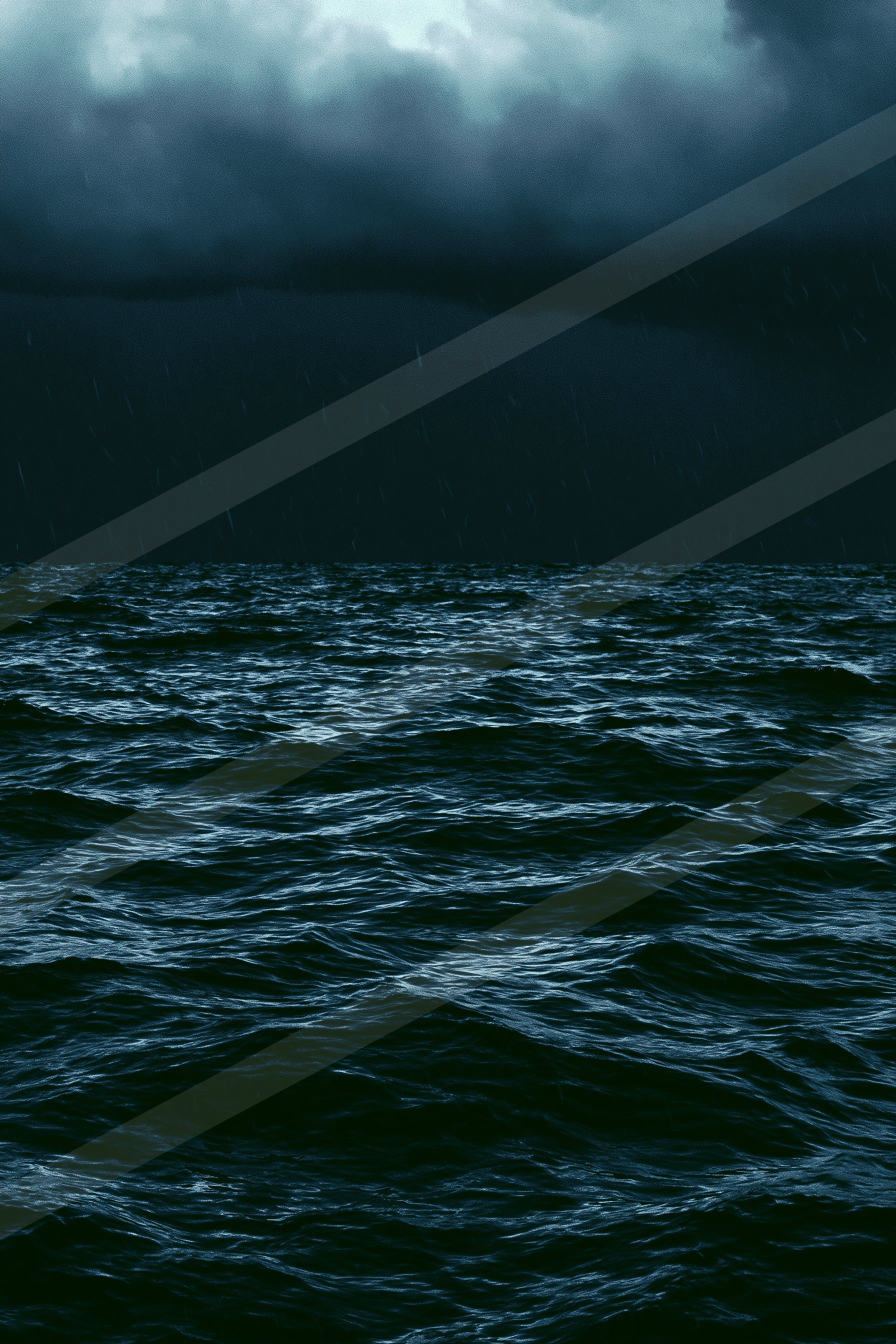 A moody high contrast water scene of an ocean, ripples.