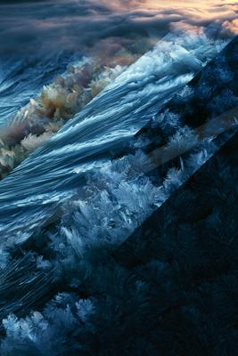 A blue hour long exposure water scene of ocean, river, reflection.