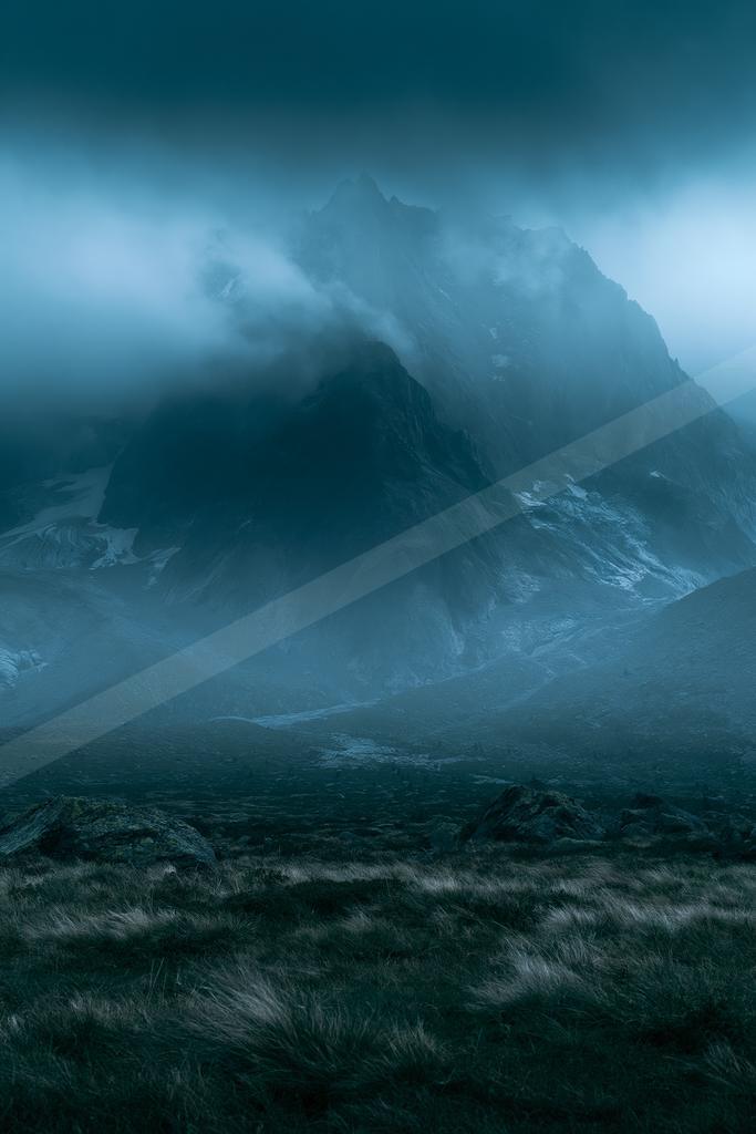 A night landscape of mountains, storm, fog.