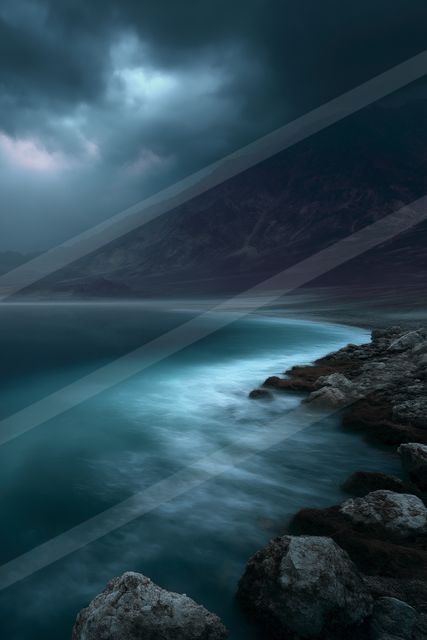 A mysterious long exposure water scene of a coastline, fog.