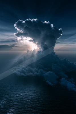 A black-toned moody photograph of volcano, geyser, wing.