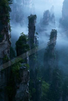 A mysterious landscape of a mountains, fog.