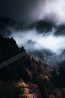 A brown-toned moody photograph of valley, alp, cliff.