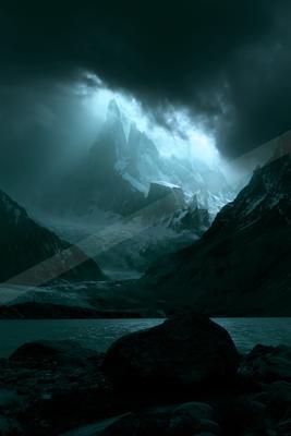 A dark, atmospheric landscape featuring towering snow-capped mountains under a moody sky with beams of light piercing through the clouds.
