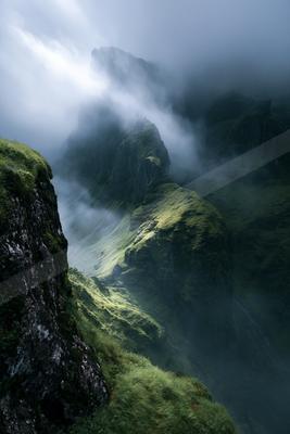 An ethereal panorama landscape of a mountains, fog.