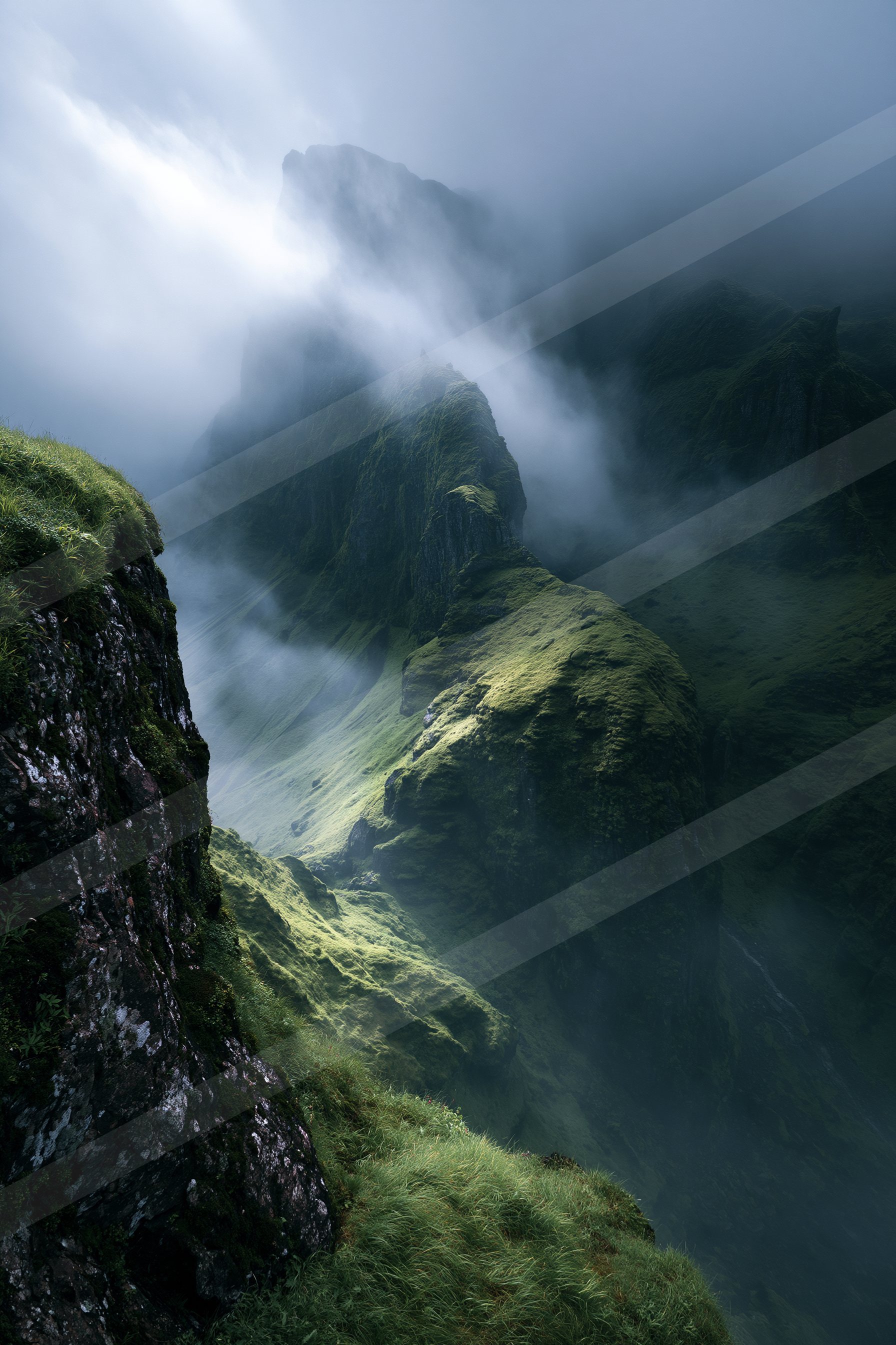 A breathtaking view of mist-covered mountain peaks surrounded by lush green vegetation, creating a serene and mysterious atmosphere.